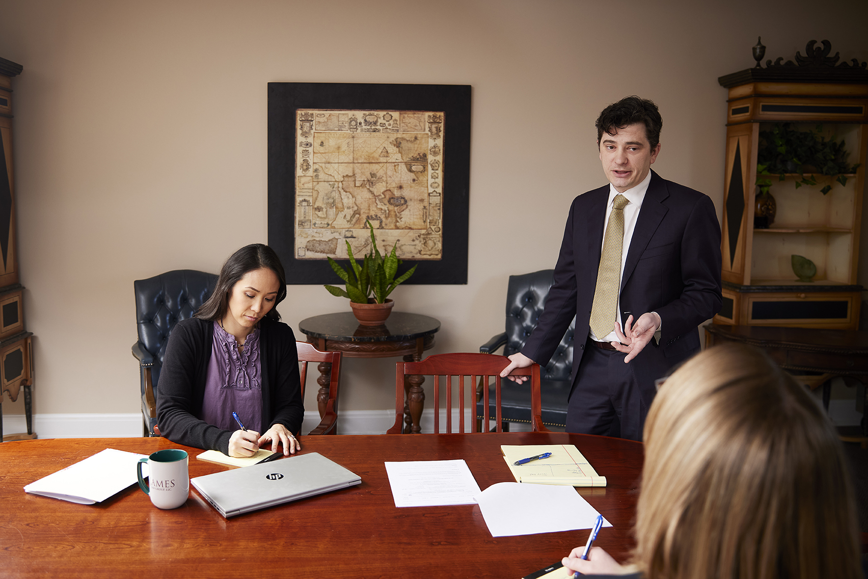 JJ LL AY in conference room sm Missouri Lawyer John James and paralegal Laura Leach sitting at conference table
